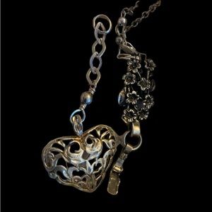 Sterling silver filagree pendant on convertible chain.